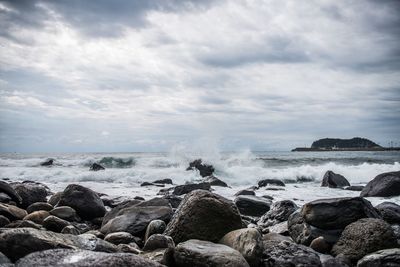 Scenic view of sea against cloudy sky