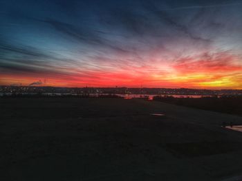 Scenic view of sunset over city