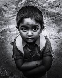 Portrait of cute boy standing outdoors