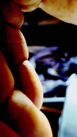 Close-up of human hand in car