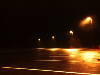 Illuminated road at night