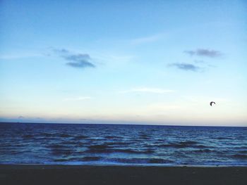 Scenic view of sea against blue sky