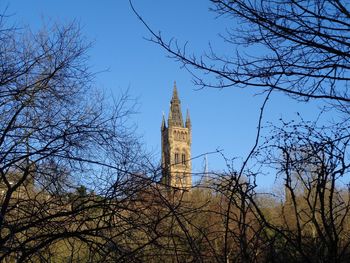 Low angle view of clock tower against sky