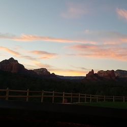 Scenic view of mountains against sky at sunset