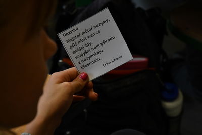 Midsection of woman reading book