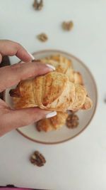Midsection of person holding breakfast