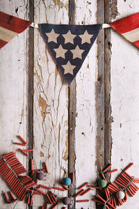 Row of flags on wall of old building