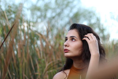 Portrait of young woman looking away