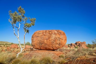 Devils marbles against clear blue sky