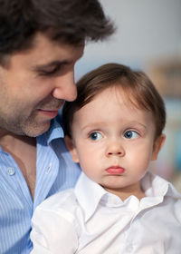 Close-up of cute son with father