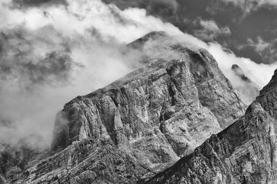 Rocky mountains against clouds