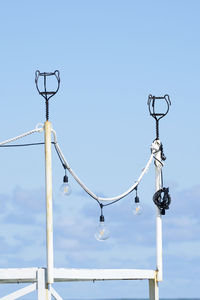 Low angle view of street light against sky