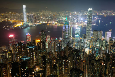 Illuminated modern buildings in city at night