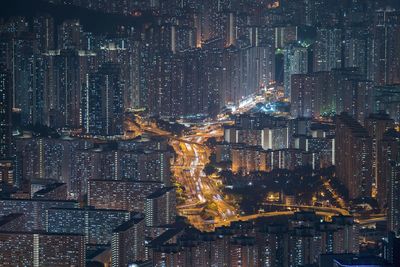 The buildings in hong kong at night as seen from lions head