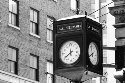 Low angle view of clock on wall