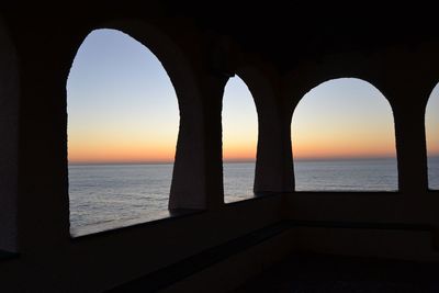 Scenic view of sea against clear sky during sunset