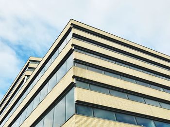 Low angle view of office building against sky