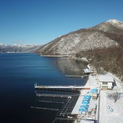 Scenic view of mountains against clear blue sky