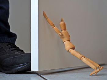 Low section of man smoking cigarette