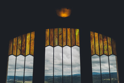 Close-up of bridge over sea against sky
