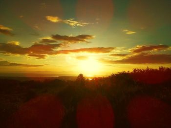 Scenic view of dramatic sky during sunset