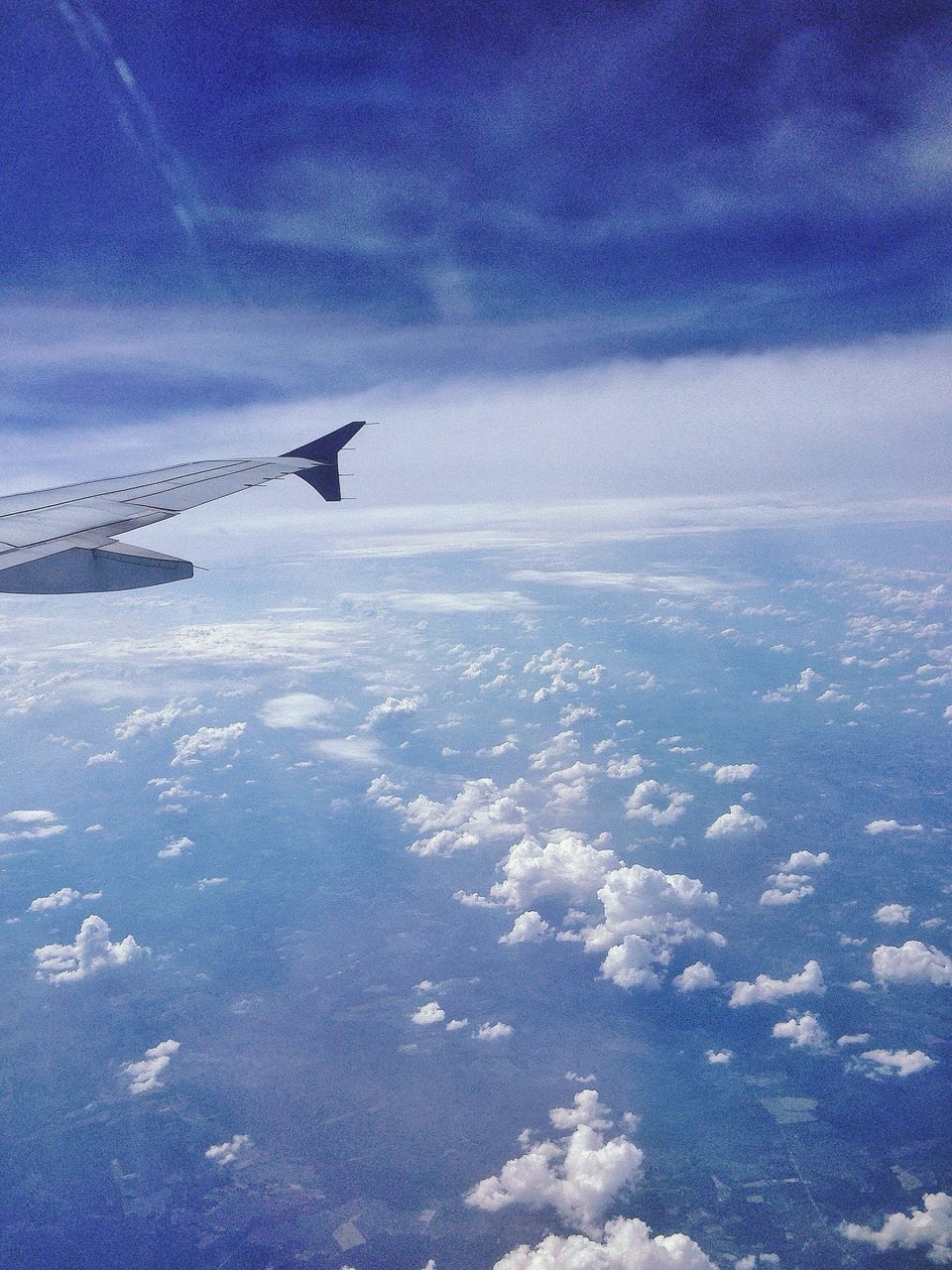 airplane, air vehicle, snow, transportation, winter, sky, flying, mode of transport, blue, aircraft wing, cold temperature, cloud - sky, scenics, weather, beauty in nature, nature, landscape, aerial view, tranquil scene, tranquility