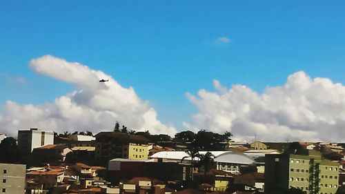 Low angle view of building against cloudy sky