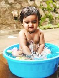 High angle view of boy playing in swimming pool