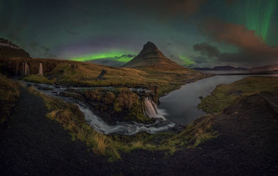 Scenic view of mountain against sky at night