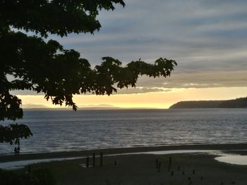 Scenic view of sea against sky at sunset