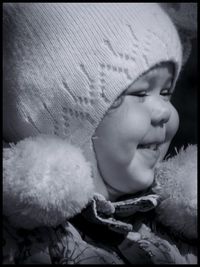 Close-up of cute baby on bed