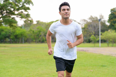 Portrait of man standing on field