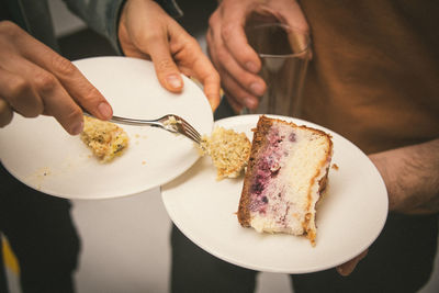 Midsection of man holding ice cream in plate