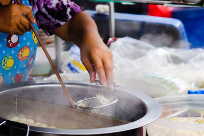 Midsection of person preparing food