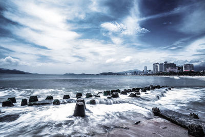 Scenic view of sea against cloudy sky