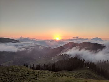 Scenic view of mountains against sky during sunset