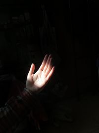 Close-up of woman hand in darkroom