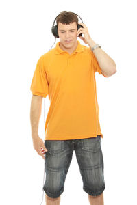 Portrait of young man standing against white background