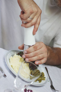 Close-up of man preparing food