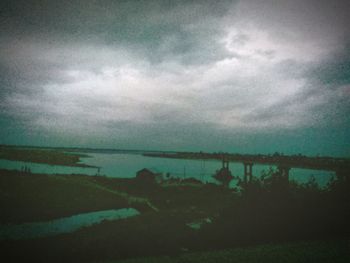 Scenic view of sea against sky at dusk