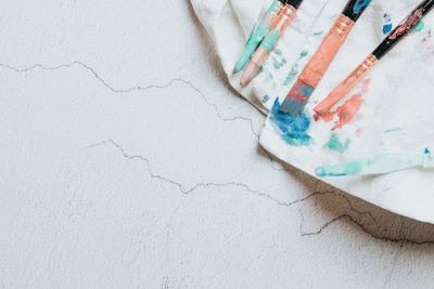 High angle view of paintbrushes on table