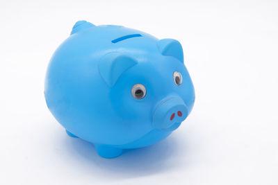 Close-up of blue toy over white background