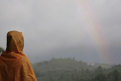 Rear view of man looking at mountains