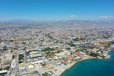 High angle view of townscape against blue sky