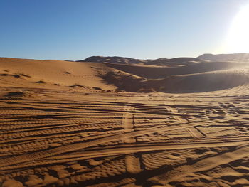 Scenic view of desert against clear sky