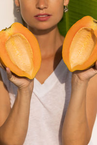 Close-up of woman holding apple