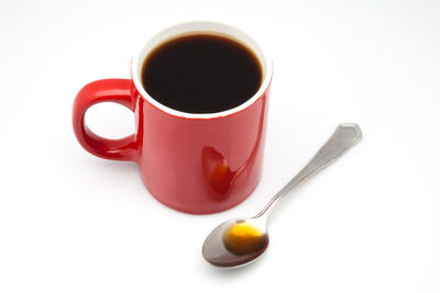 Close-up of coffee cup against white background