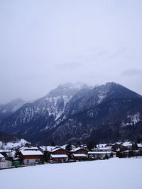 Scenic view of snowcapped mountains against sky during winter