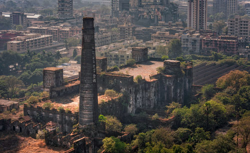 High angle view of buildings and abandoned factory in city