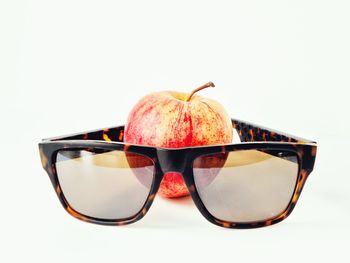 Close-up of sunglasses against white background